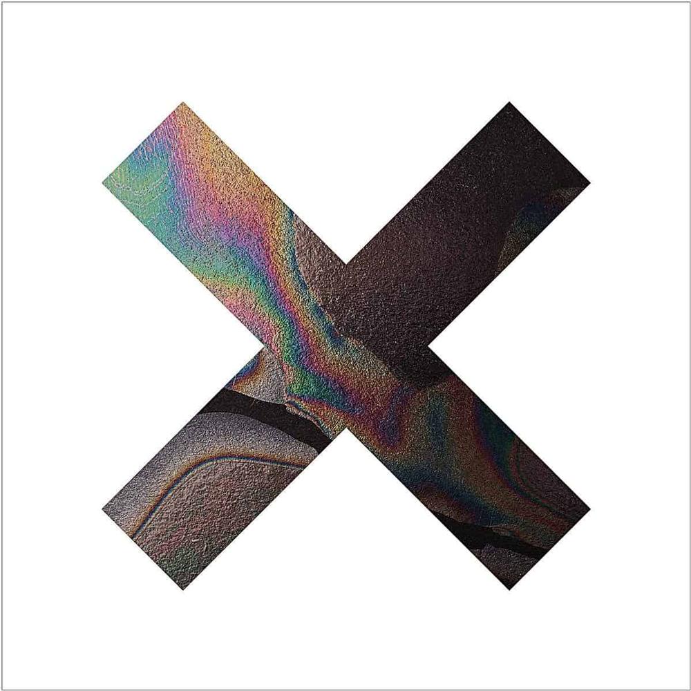 The XX Coexist mint green turquoise 12-inch vinyl LP disc with visible centre label