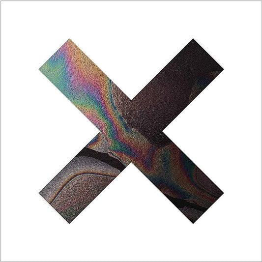 The XX Coexist mint green turquoise 12-inch vinyl LP disc with visible centre label