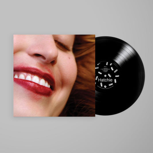 Liquorice LP black vinyl with close-cropped portrait cover of Harriette Pilbeam photographed in a backyard
